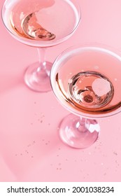 Two Glasses With Sparkling Rose Wine On Pink Background, St. Valentines Day Greeting Card