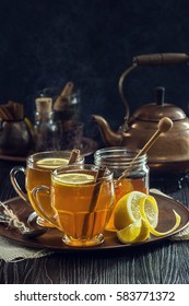 Two Glasses of Steaming Hot Lemon Spiced Tea or Hot Toddies for a Cold Winter's Day