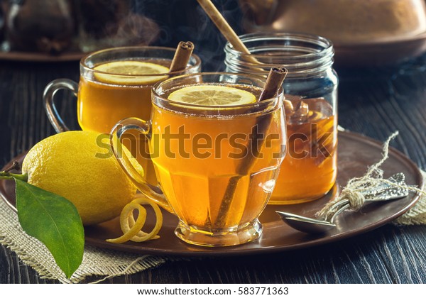 Two Glasses of Steaming Hot Lemon Spiced Tea\
or Hot Toddies for a Cold Winter\'s\
Day
