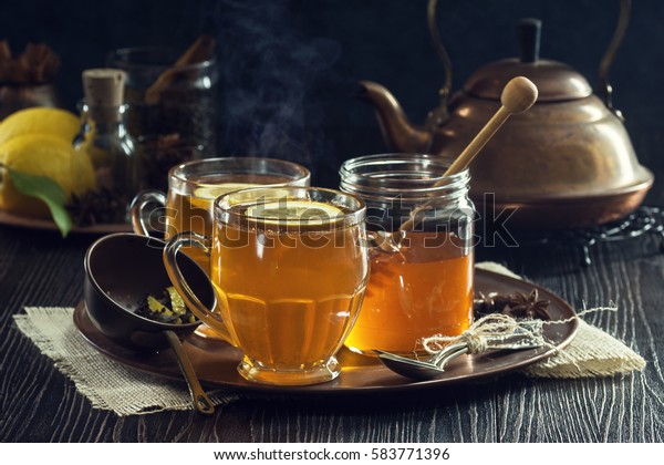 Two Glasses of Steaming Hot Lemon Spiced Tea\
or Hot Toddies for a Cold Winter\'s\
Day