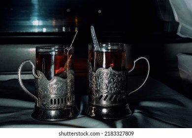 Two Glasses Of Tea In Retro Teacups On A Train. Travel Concept.