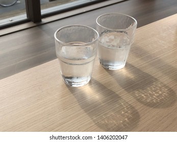 Two glasses of water glittering