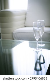 Two Glasses Of Water On A Glass Table. No People