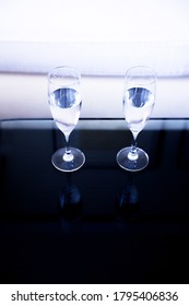 Two Glasses Of Water On A Glass Table. No People