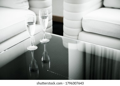 Two Glasses Of Water On A Glass Table. No People