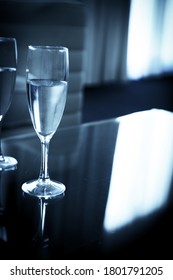 Two Glasses Of Water On A Glass Table. No People