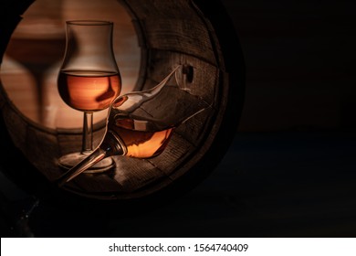 Two Glasses Of Whiskey In An Oak Barrel