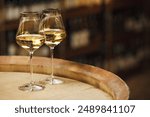 Two Glasses of White Wine on Wooden Barrel, Close up