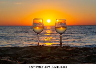 Two Glasses Of Wine On A Beach At Sunset, Sicily Island, Italy