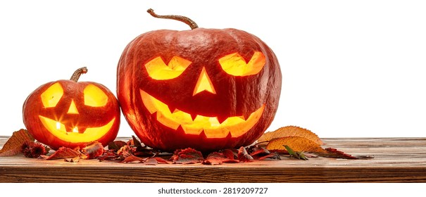 Two glowing Halloween jack o lantern pumpkins isolated on a white background. Clipping Path.
