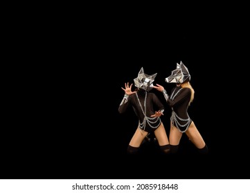 Two Go-go Variety Show Dancers In Wolf Masks On Black