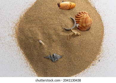 Two Gold Rings In The Sand, Valuable Objects In The Beach