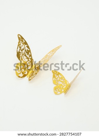 Two Golden 3D Openwork Paper Butterflies Isolated on White Background