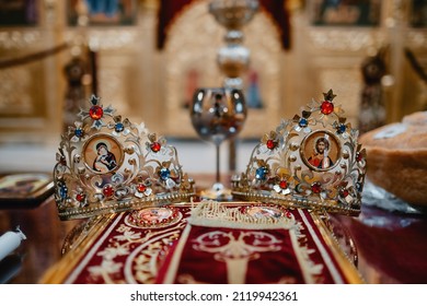 Two Golden Wedding Crowns In Orthodox Church During Wedding Ceremony