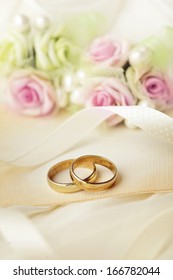 two golden wedding rings, wedding invitation
