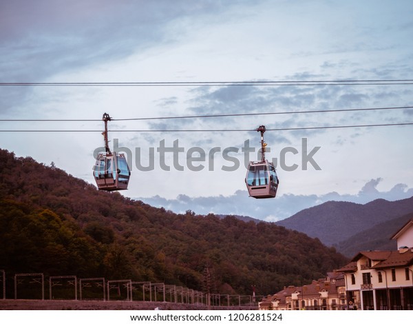 Two gondola lift in the background of\
the mountains of Krasnaya Polyana Sochi\
09/29/2018