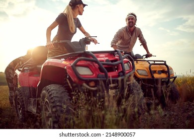 Two Good Friends Driving Quads Together In The Nature; Active Vacation Concept