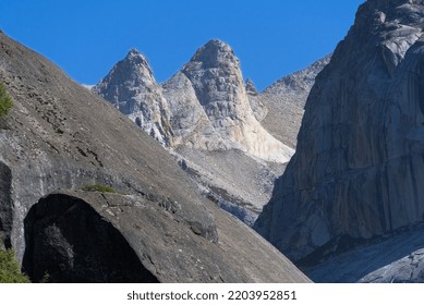 Two Grand Boulders Are Between Two Giant Granite Mountain Peaks.