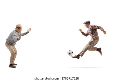Two grandfathers playing soccer isolated on white background
