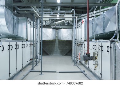 Two Gray Industrial Air Handling Units In The Ventilation Plant Room