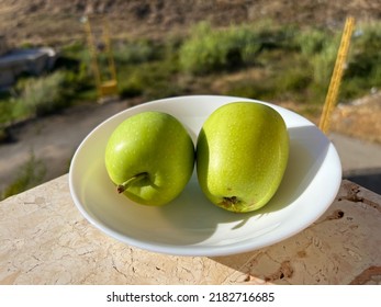 Two Green Apples In A White Place