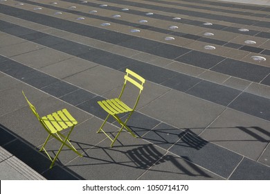 Two Green Chairs Facing Each Other