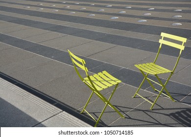 Two Green Chairs Facing Each Other