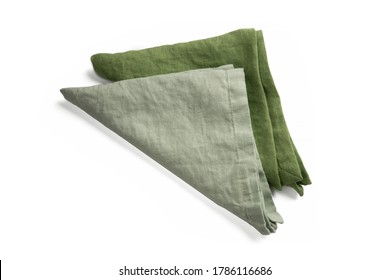 Two Green Linen Organic Raw Cotton Serving Napkin Or Kitchen Towelette Or Towel Triangle Form Folded. Rough Texturized Cloth Fabric Isolated On White Background. Table Setting Tissue Top View