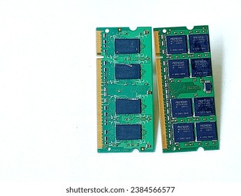 Two green memory ram placed on a white background. Close -up shot of the memory ram.