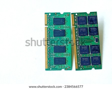Two green memory ram placed on a white background. Close -up shot of the memory ram.