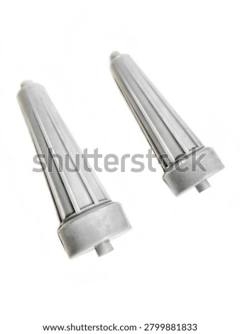 Two grey plastic pulsator rollers for washing machine, side roller agitator parts, washing machine spare parts isolated on white background with soft shadow. Pair of white plastic side pulsator rollers for automatic washing machine. Agitator part, washing machine component, spare part for repair. Isolated on white background, macro product photography.