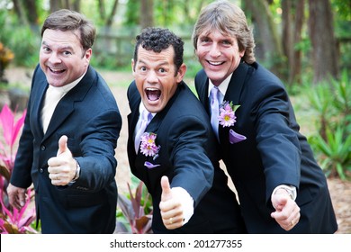 Two Grooms And Their Minister Giving A Thumbs Up At Their Gay Wedding.  