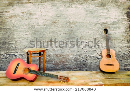 two guitars with the old peeled plaster