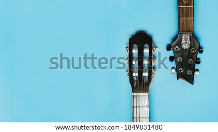 two guitars on a blue background