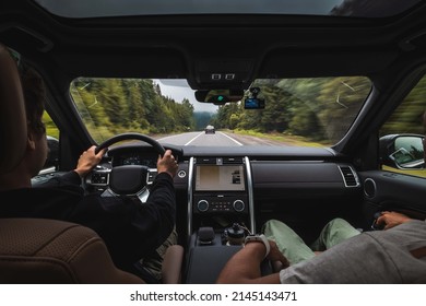 Two Guys Driving A Car From The Cabin Road View