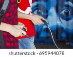 Two guys playing on the console