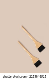 Two hair coloring brushes with wooden handle.Professional brush for applying paint in beauty industry. Pattern of brushes for applying paint to hair.Flat lay.Top view.Copy space. - Shutterstock ID 2253848515