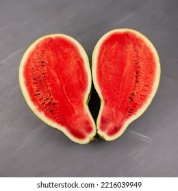 Two Half Of Pear-shaped Watermelon. Deformed Ugly Watermelon. Concept - Food Waste Reduction. Eating Imperfect Foods.