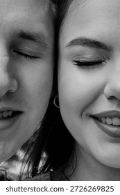 Two half-faces next to each other, a man and a woman, in monochrome. Concept of the other half, love, and relationships. Half-face close-up.