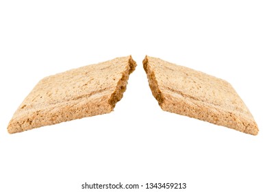 Two halves of the broken crispy bread on a white background, isolated.
