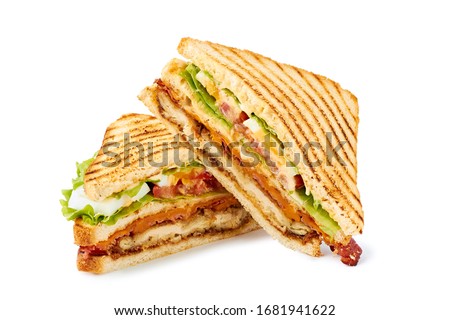Two halves of club sandwich on white