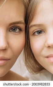 Two Halves Of The Face Of A Mother And Daughter In Close-up. Portrait Of A Happy Mother And Child, Green Eyes