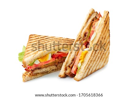 Two halves of fresh club sandwich on white