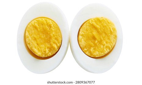 Two halves of a hard boiled egg with yellow yolk and white albumen