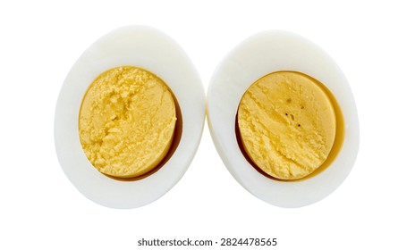 Two halves of a hard boiled egg showing yellow yolk and white albumen