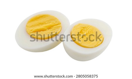 Two halves of a hard boiled egg showing yellow yolk and white albumen