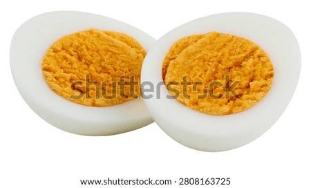 Two halves of a hard boiled egg with yellow yolk and white albumen