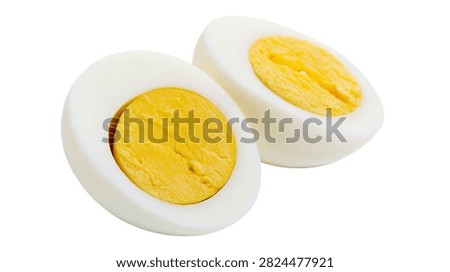 Two halves of a hard boiled egg with yellow yolk and white albumen
