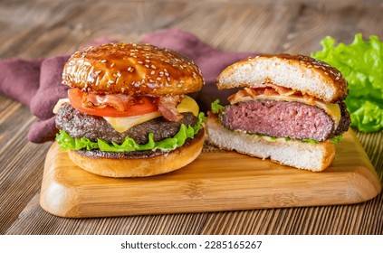 Two hamburgers on the wooden board close-up - Powered by Shutterstock