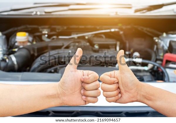 Two hand of Auto mechanic or driver\
checks steering and gear system and start system before driving at\
service station,change and repair before drive\
\
